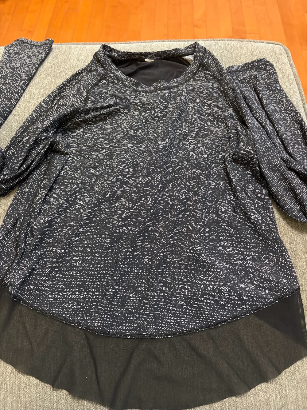Lululemon Quick Pace Long Sleeved Black Speckled Top with a Crossover Mesh Back